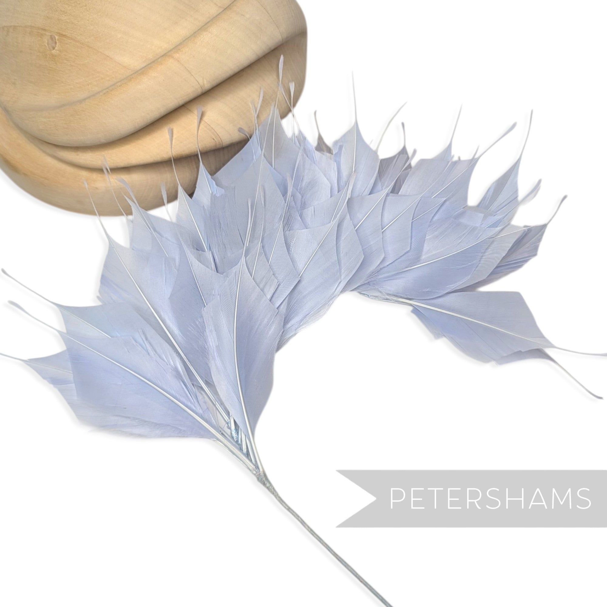 Petershams Millinery Supplies large spiky powder blue  goose feather hat mount on a wired stem for headpiece design.