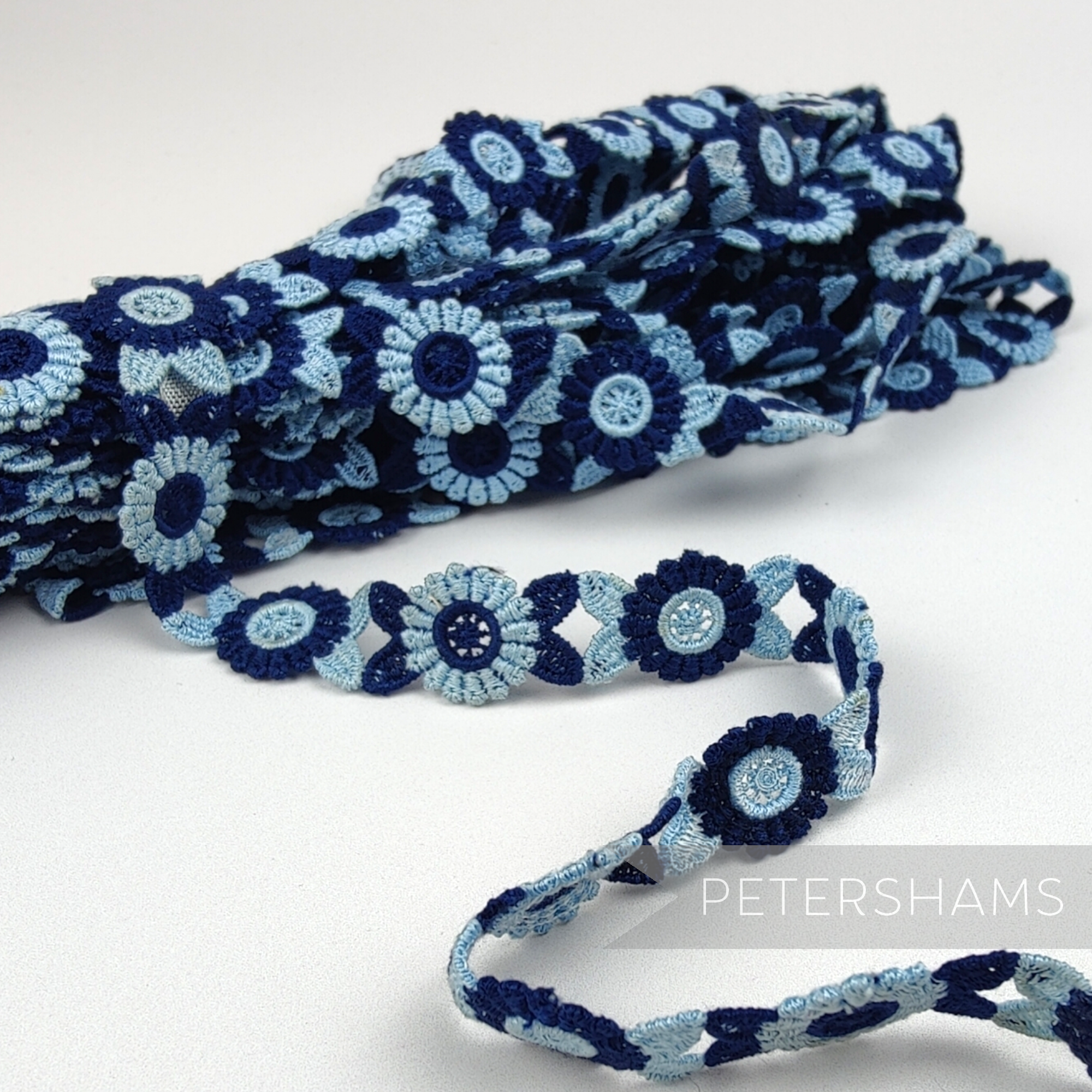 Petershams Millinery Supplies vintage 18mm blue and navy guipure lace trim with a 3D floral pattern