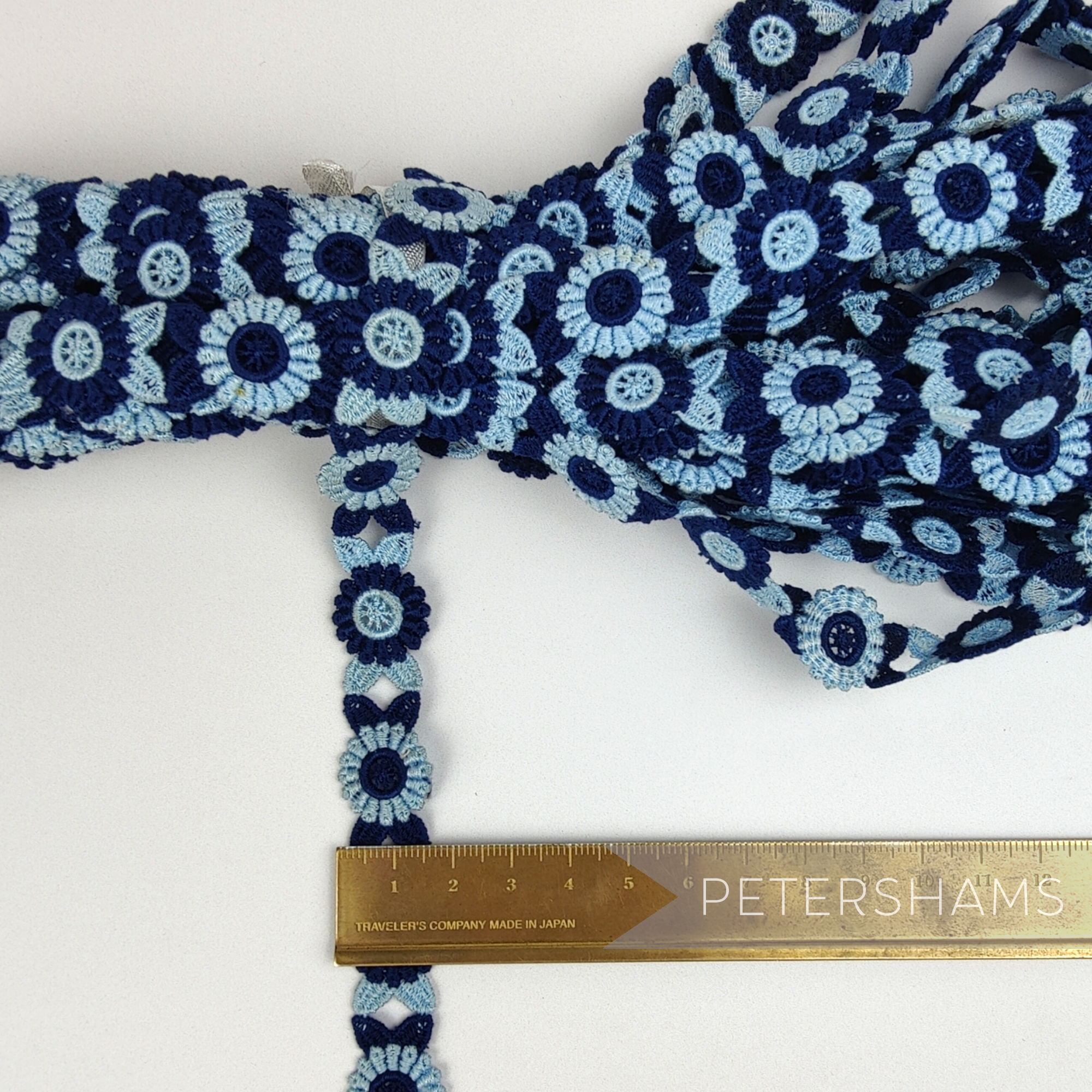 Petershams Millinery Supplies vintage 18mm blue and navy floral guipure lace trim on a white background