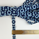 Petershams Millinery Supplies vintage 18mm blue and navy floral guipure lace trim on a white background