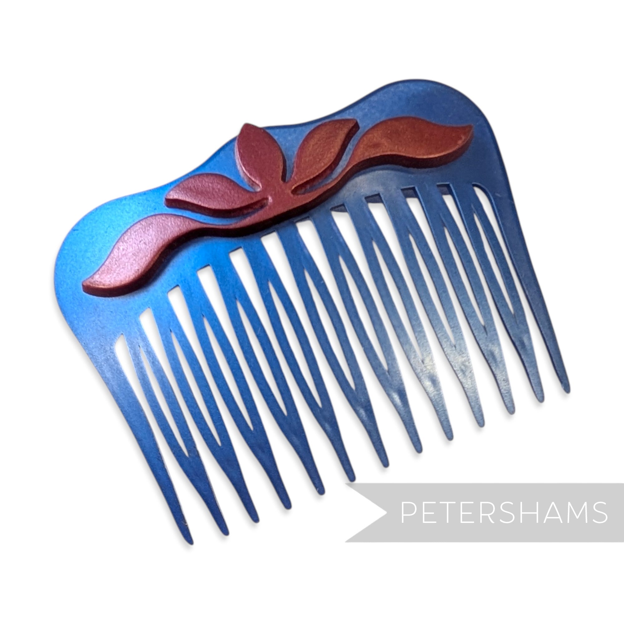 Petershams Millinery Supplies vintage blue pearlised plastic hair comb with a raised red floral relief motif