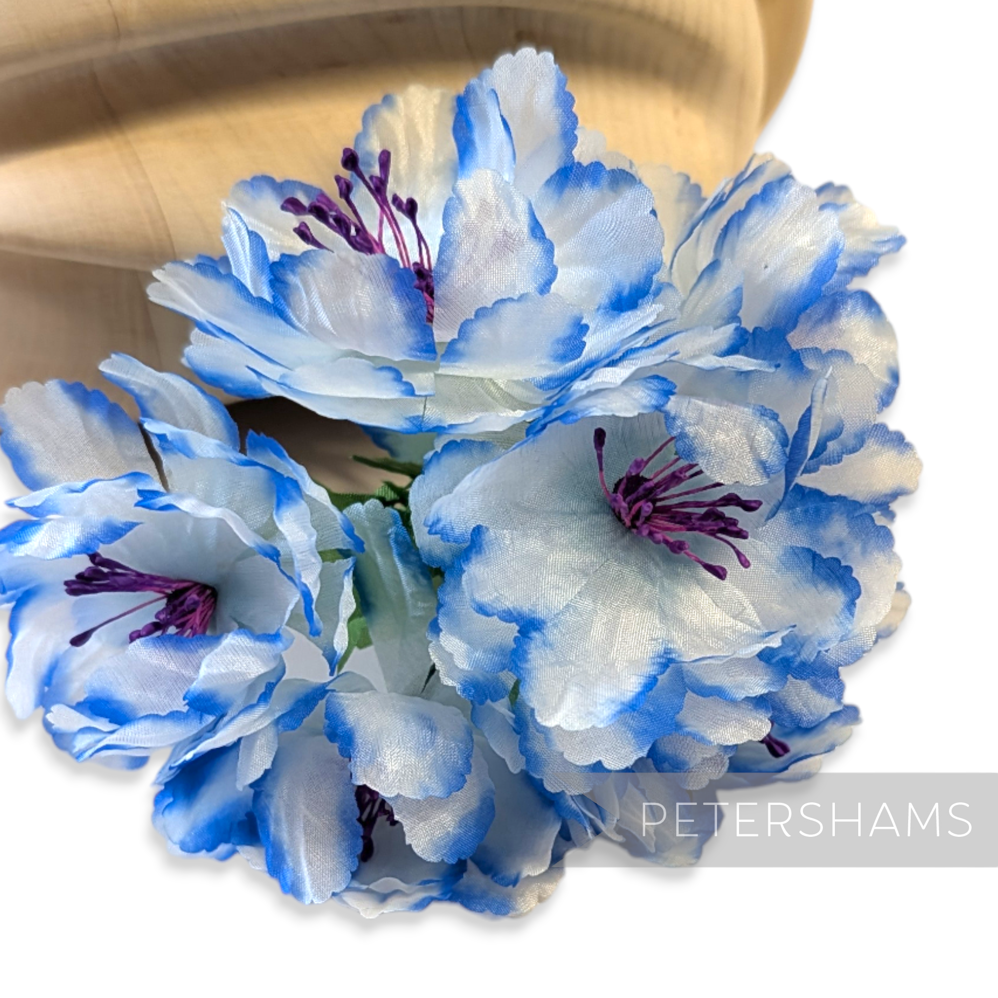 Petershams Millinery Supplies vintage wired flower mount with fluffy light blue petals and dark blue contrast edges.
