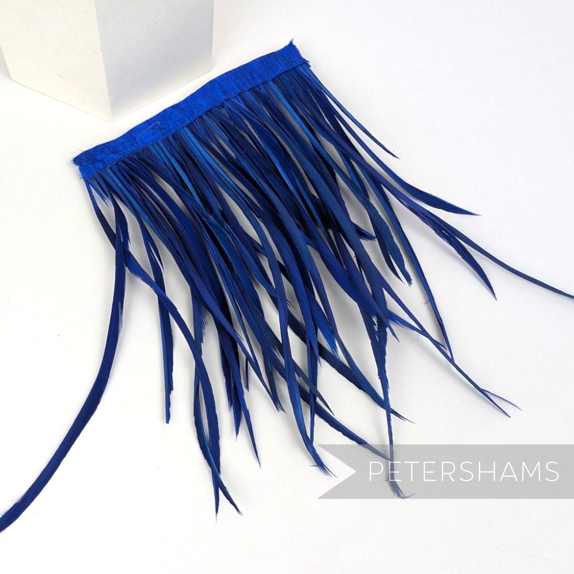 Petershams Millinery Supplies extra long royal blue goose biot feather fringe with satin ribbon binding