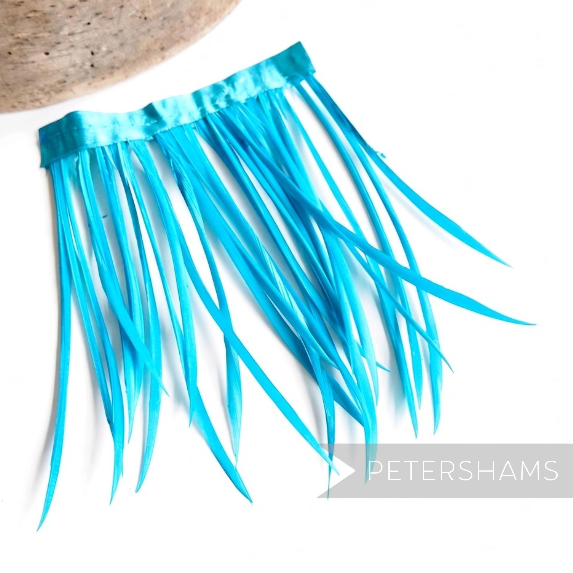Petershams Millinery Supplies bright turquoise goose biot feather fringe with satin ribbon binding for millinery