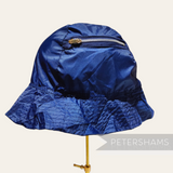 Petershams Millinery Supplies vintage 1990s blue nylon splashproof bucket hat with a built-in zippered storage pouch.