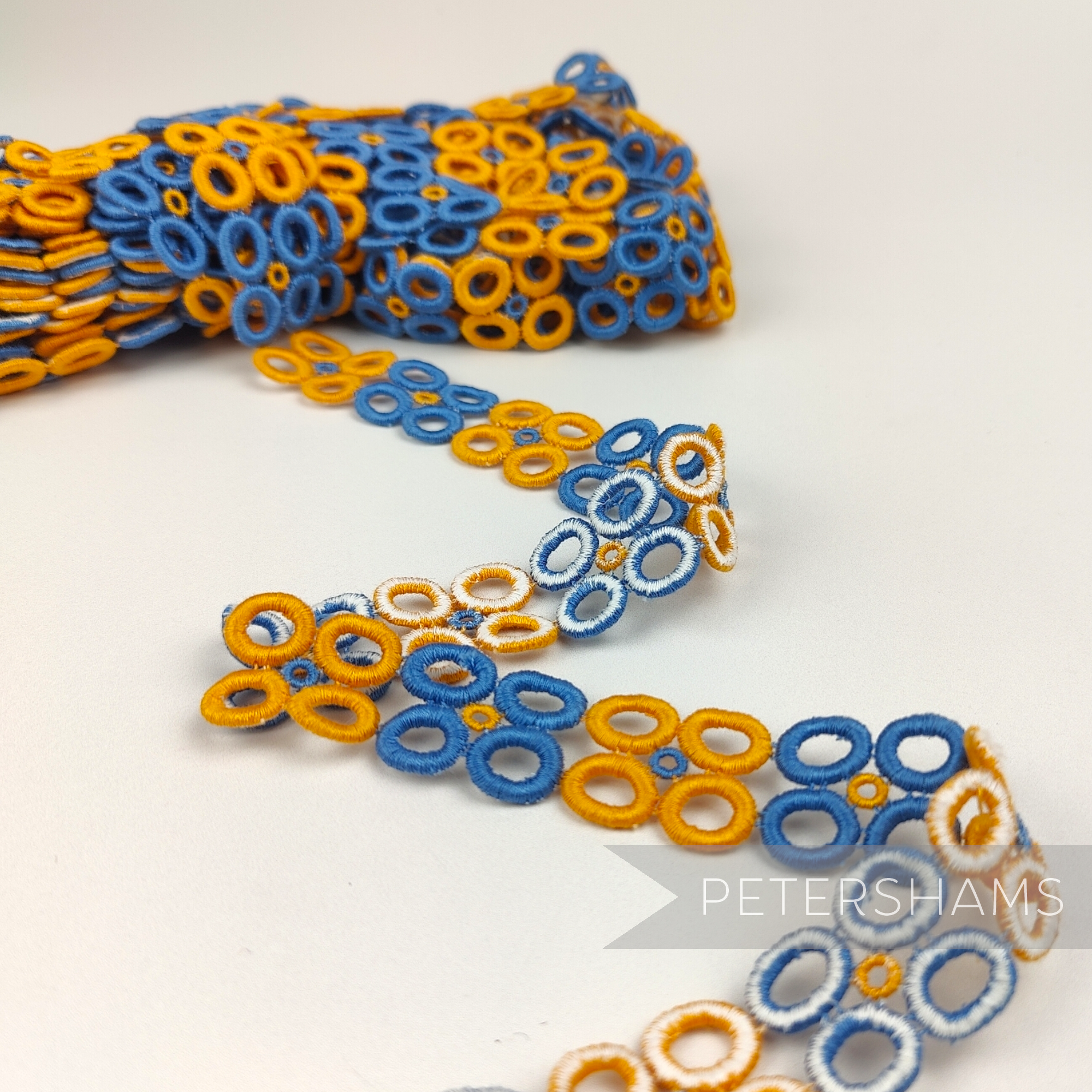 Petershams Millinery Supplies vintage 1950s blue and orange doughnut quad guipure lace trim, 22mm wide