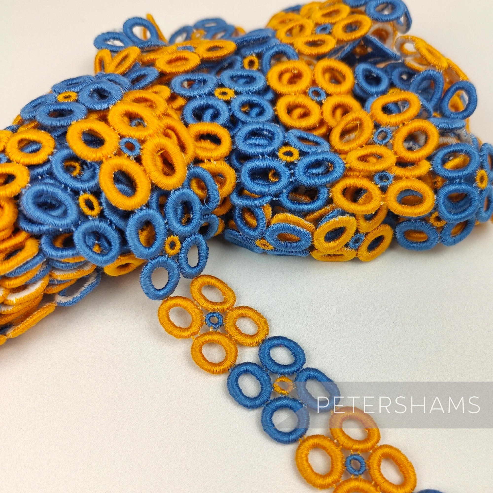 Petershams Millinery Supplies vintage 1950s blue and orange doughnut quad guipure lace trim, 22mm wide