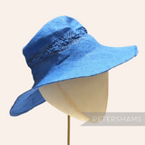 Petershams Millinery Supplies blue paper capeline hat body with decorative open weave side vent