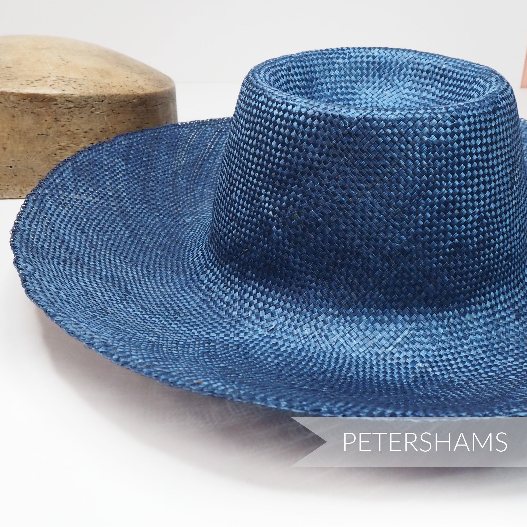 Petershams Millinery Supplies  navy blue ramie straw capeline hat body with a 1x1 checker weave and smooth ironed finish.