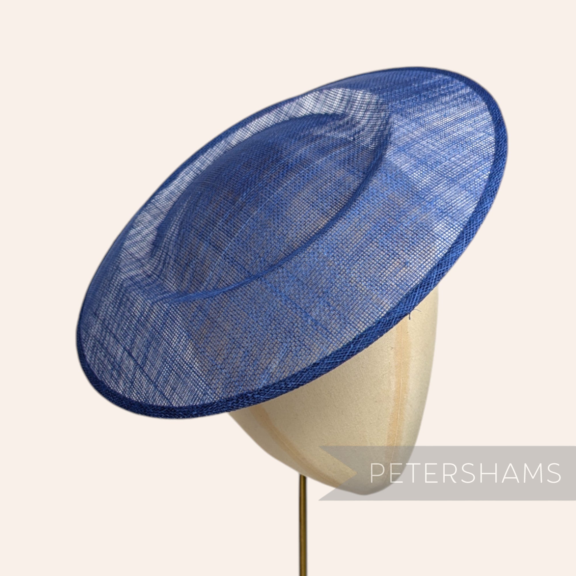 Petershams Millinery Supplies 29cm deep royal blue round sinamay fascinator hat base on a mannequin head