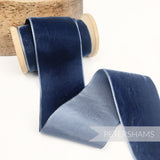 Petershams Millinery Supplies 50mm wide slate blue French velvet ribbon on a wooden spool with a luxurious sheen.