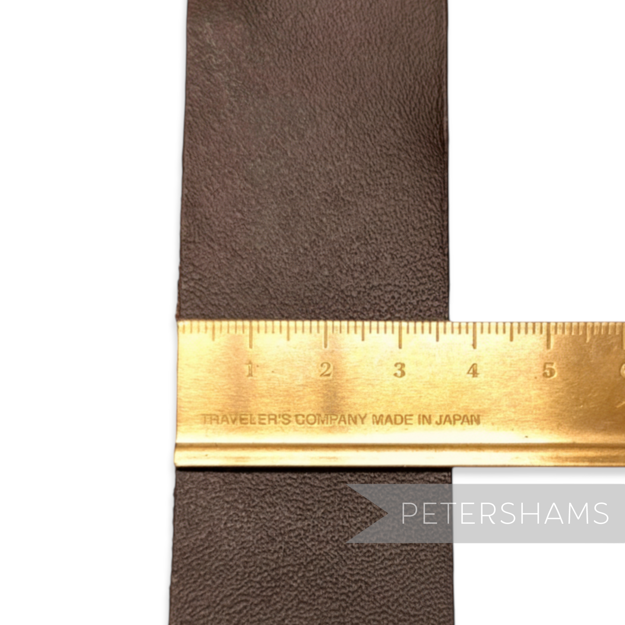 Petershams Millinery Supplies dark brown textured real leather hat band with raw edge, 66cm long.