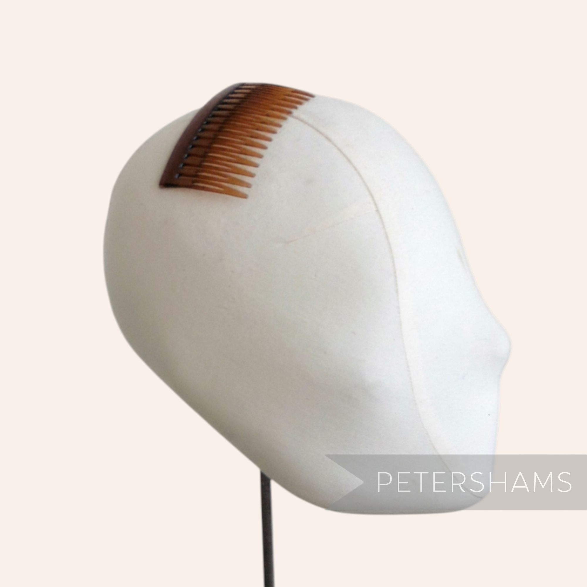 Petershams Millinery Supplies brown 7cm plastic hair comb, ideal for sewing into hats and veils.
