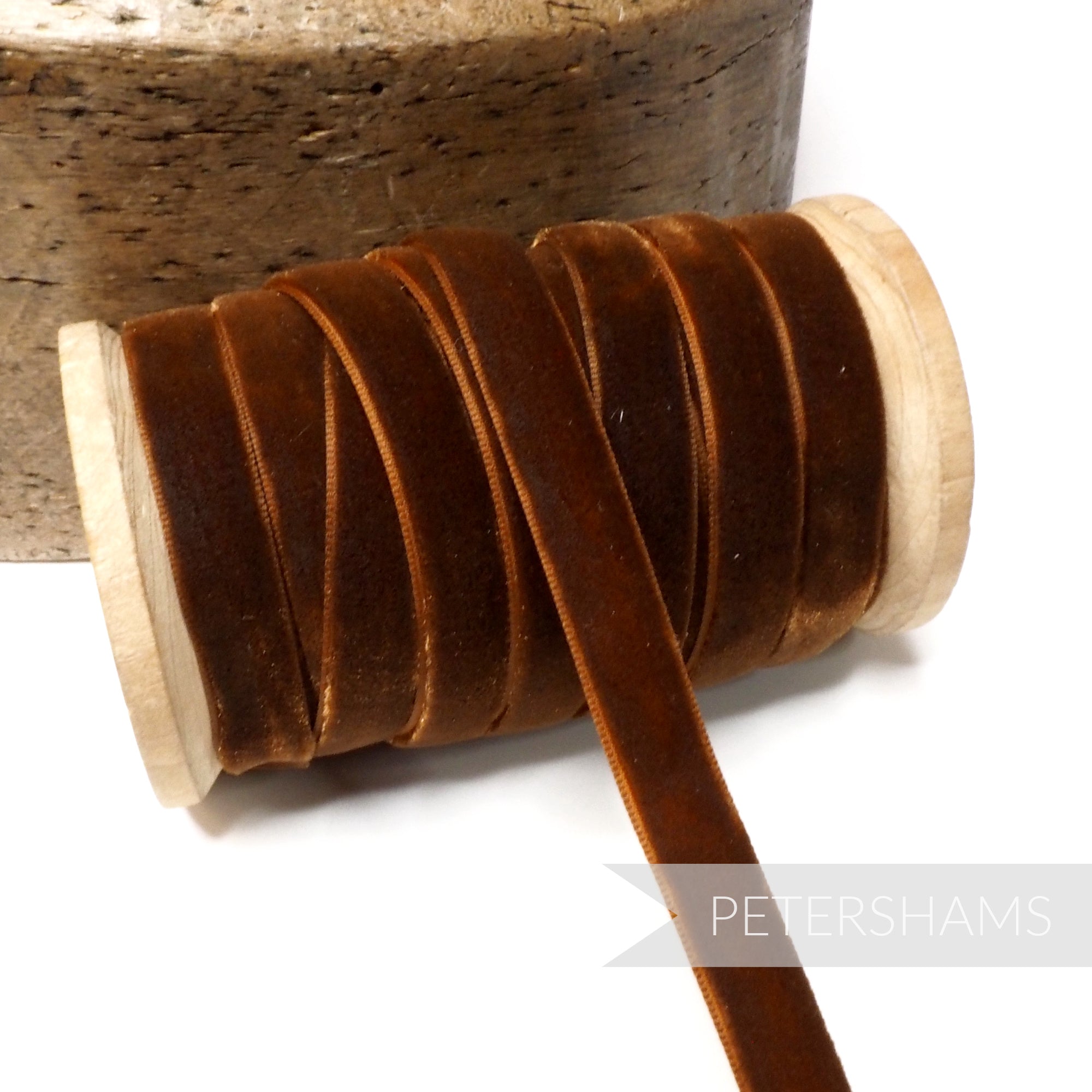 Petershams Millinery Supplies 10mm rust vintage rayon velvet ribbon on a wooden spool for millinery and craft projects.