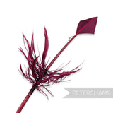 Petershams Millinery Supplies burgundy turkey quill feather cut into an arrowhead shape with decorative barbed accents