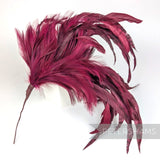 Petershams Millinery Supplies extra large burgundy feather hat mount with chinchilla, stripped coque, and hackle.