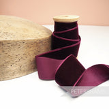 Petershams Millinery Supplies 36mm bordeaux French velvet ribbon on a wooden spool