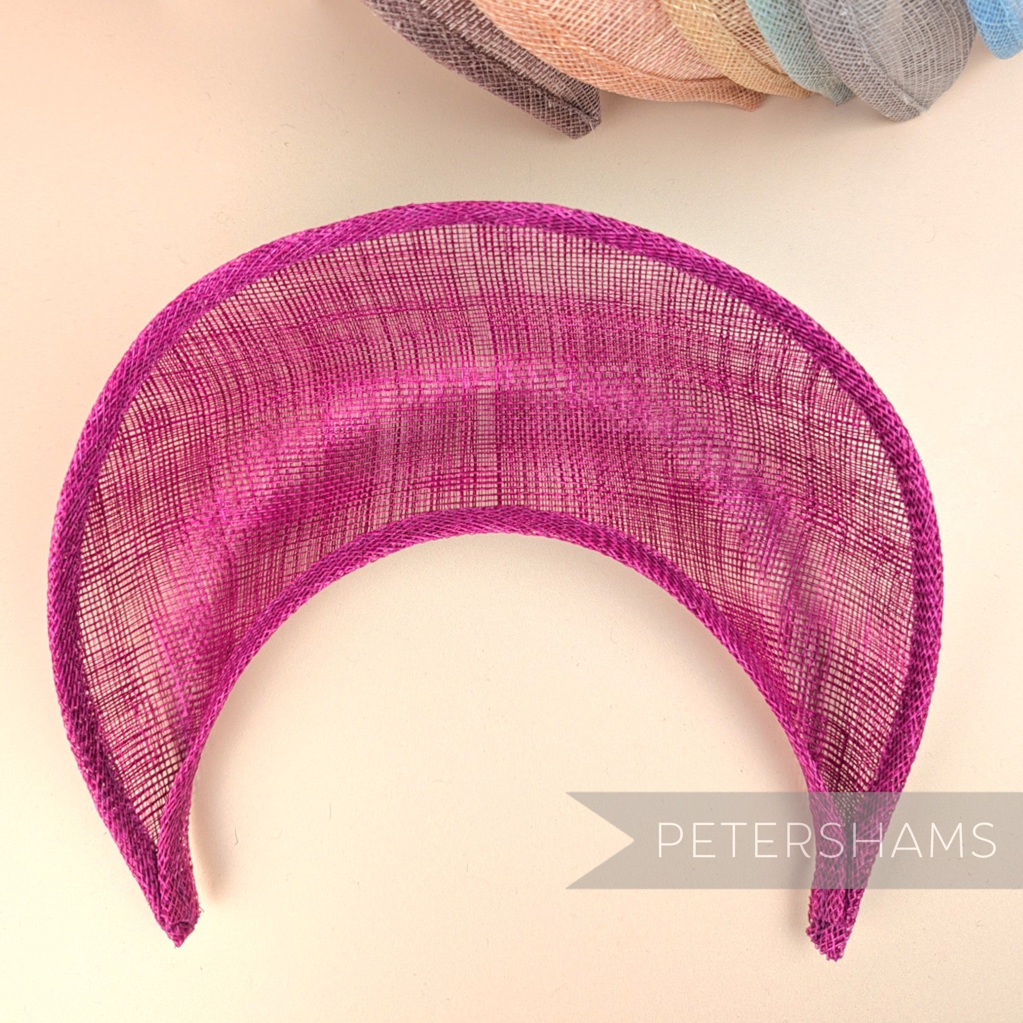 Petershams Millinery Supplies cerise pink sinamay halo crown fascinator hat base with a domed crescent shape.
