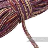 Petershams Millinery Supplies 15mm chenille threaded crin braid in a wavy purple and gold striped pattern.