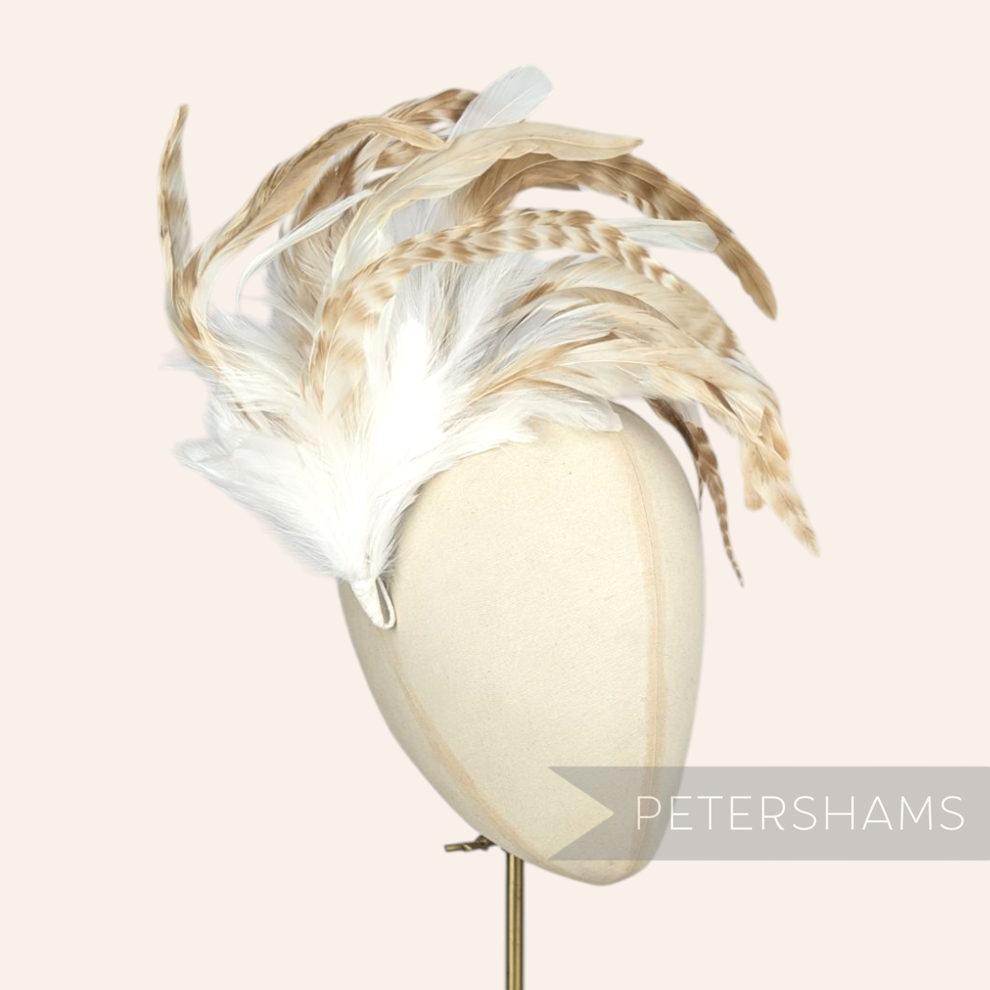 Petershams Millinery Supplies extra large chinchilla pattern coque and hackle feather hat mount on a mannequin head