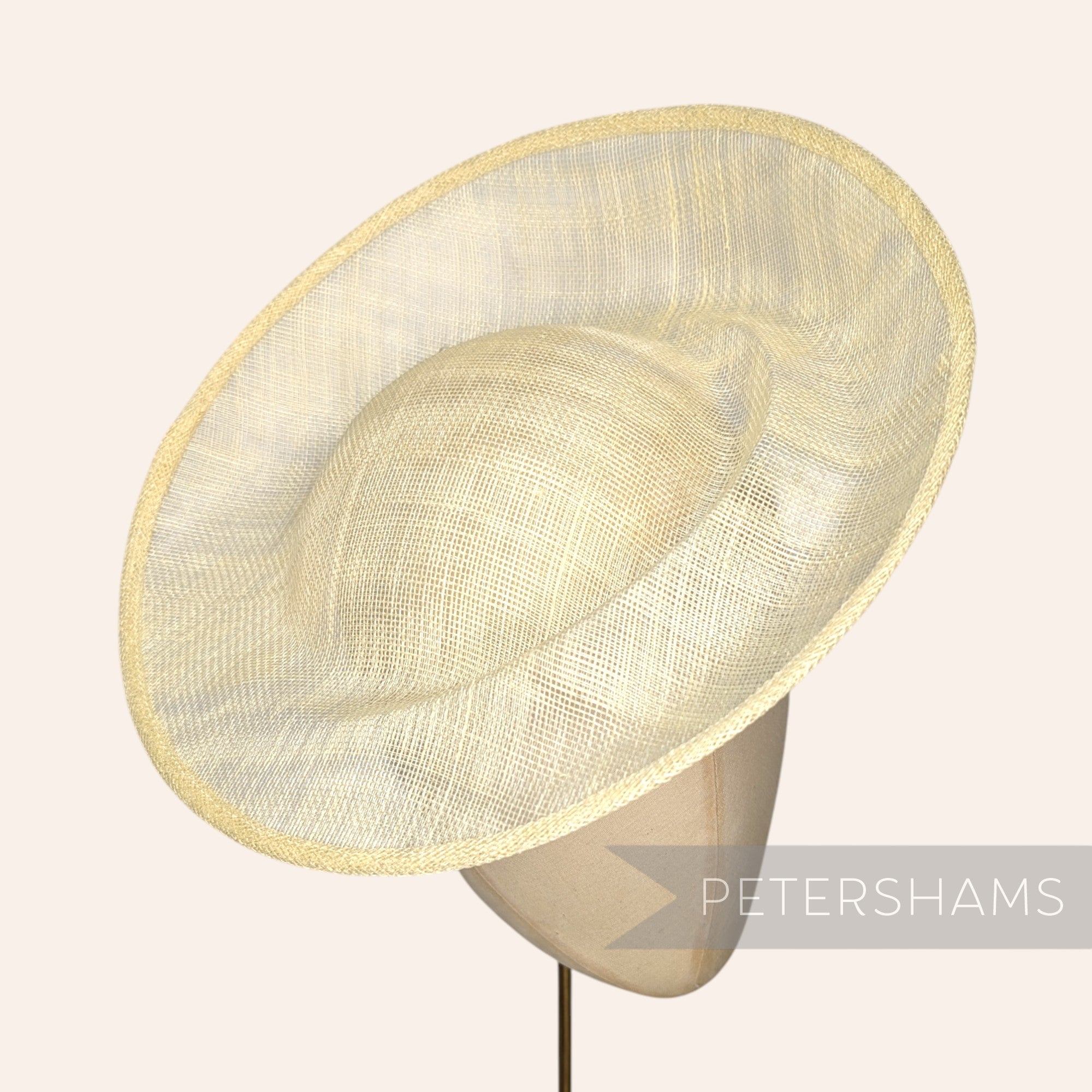 Petershams Millinery Supplies Cindy sinamay fascinator hat base in butter yellow  with an orbital pleat and upturned edge.