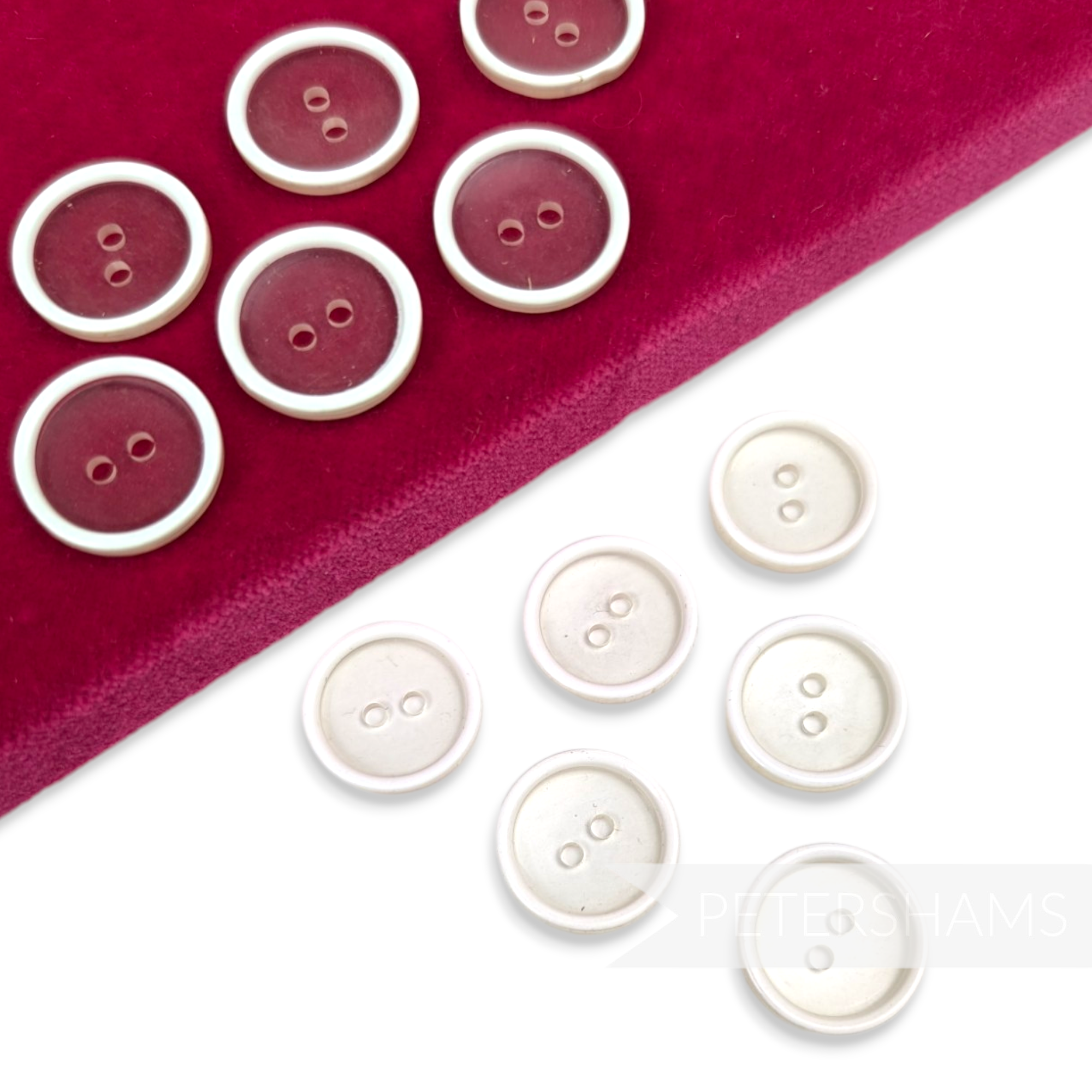 Petershams Millinery Supplies vintage 18mm clear plastic buttons with white rim detail on a red velvet display pad