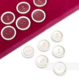 Petershams Millinery Supplies vintage 18mm clear plastic buttons with white rim detail on a red velvet display pad