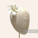Petershams Millinery Supplies Coco silk orchid flower hat mount in white on a millinery display head