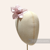 Petershams Millinery Supplies Coco silk orchid flower hat mount in soft pink on a millinery display head