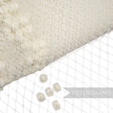 Petershams Millinery Supplies vintage replica cream veiling with a chenille dotted diamond pattern for hat making.