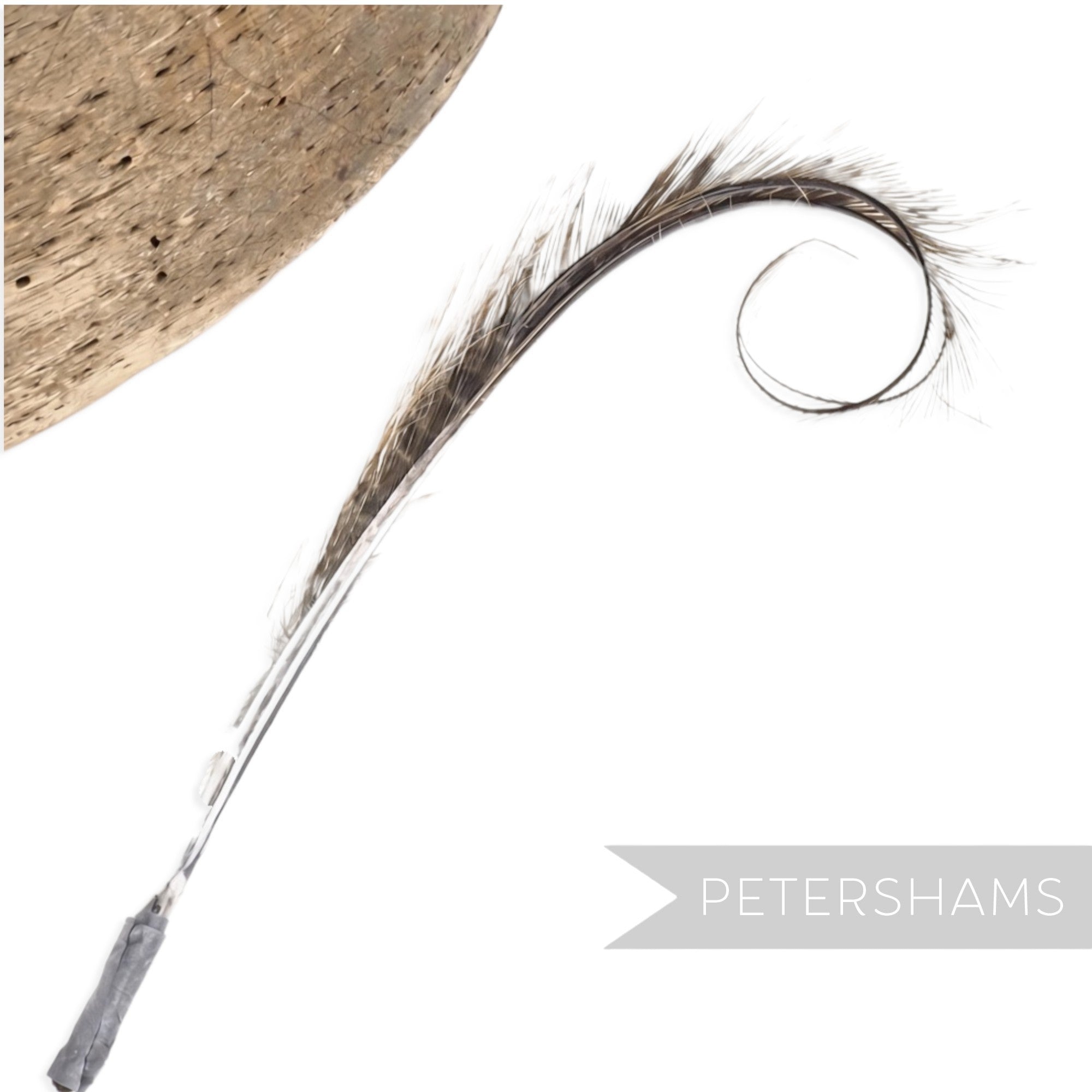 Petershams Millinery Supplies curled and burnt pheasant feather hat mount with a wispy, delicate texture.