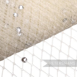Petershams Millinery Supplies cream diamond-patterned veiling embellished with clear acrylic diamantes for millinery.