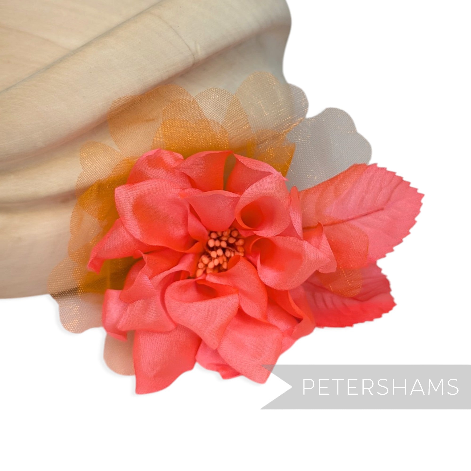 Petershams Millinery Supplies Dilliah dahlia hat mount with coral silk petals, organza layers, and wired leaves.