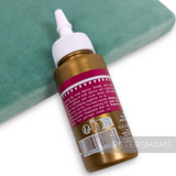 Petershams Millinery Supplies 60ml no-sew hi-tack fabric glue tube with applicator tip on a green velvet surface