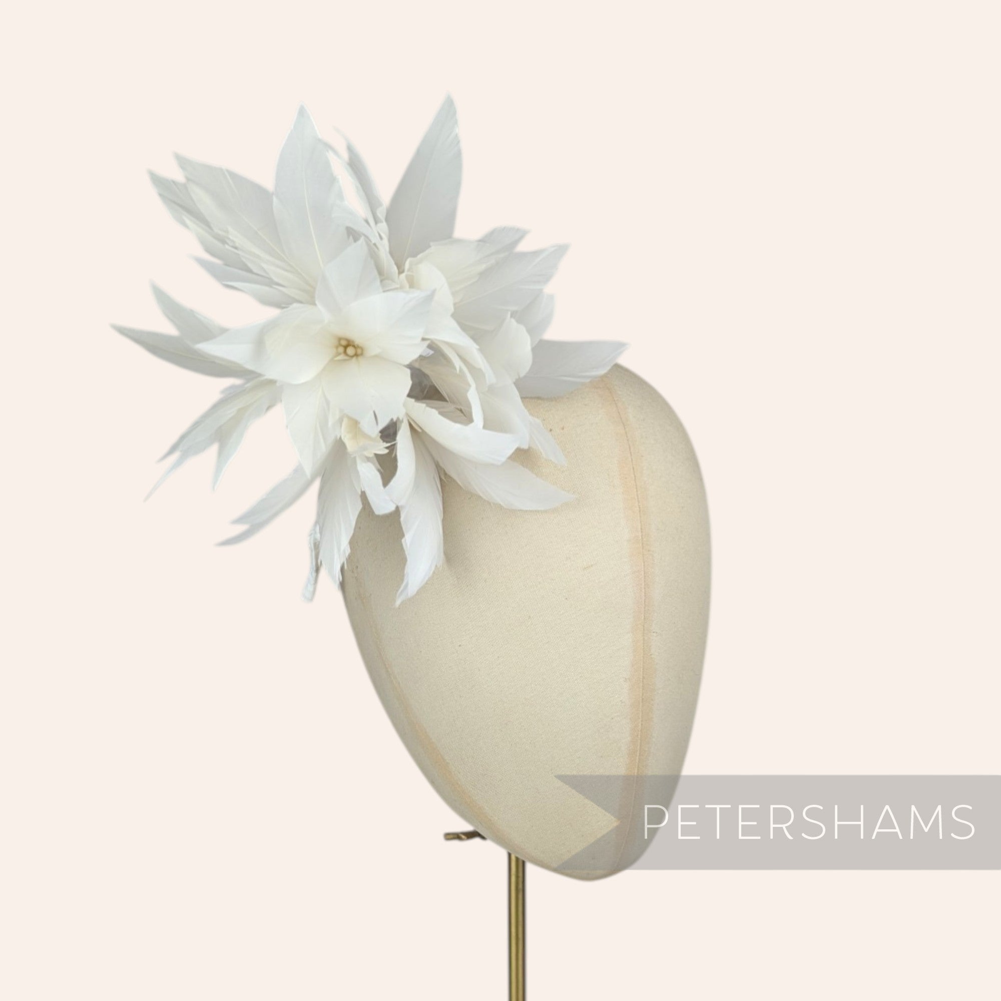 Petershams Millinery Supplies Kay large ivory goose feather pom flower hat mount on a millinery head block
