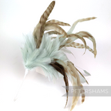 Petershams Millinery Supplies extra large feather hat mount with chinchilla pattern coque, stripped, and hackle plumes.