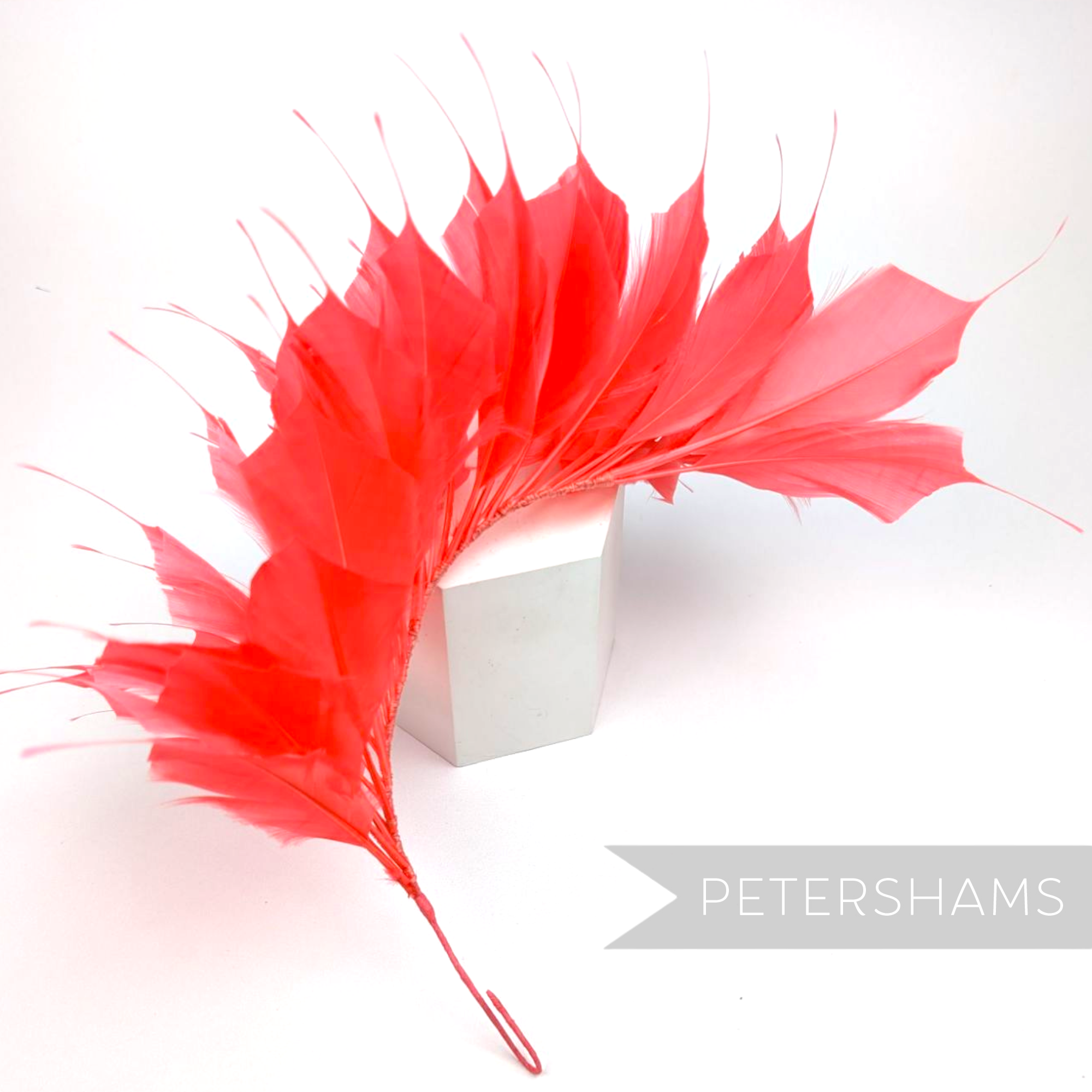 Petershams Millinery Supplies large coral spiky goose feather wired hat mount for millinery and headpiece design.