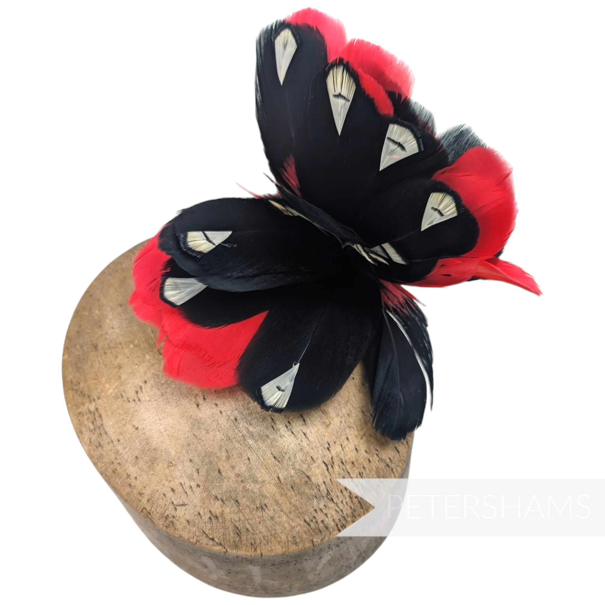 Petershams Millinery Supplies large feather hat mount with black and red goose nagorie and french partridge feathers.