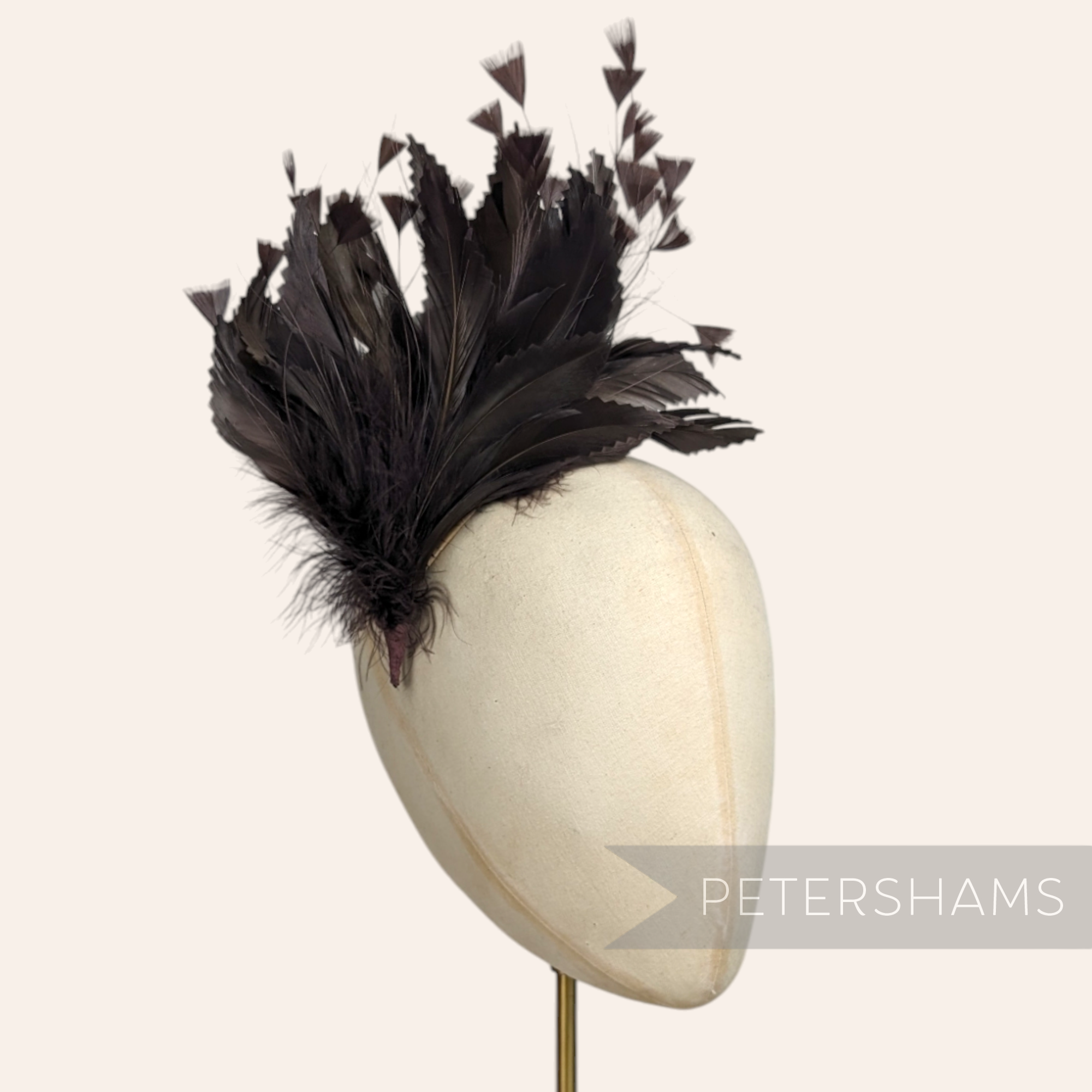 Petershams Millinery Supplies chocolate brown feather hat mount featuring zig zag goose, coque, and peacock