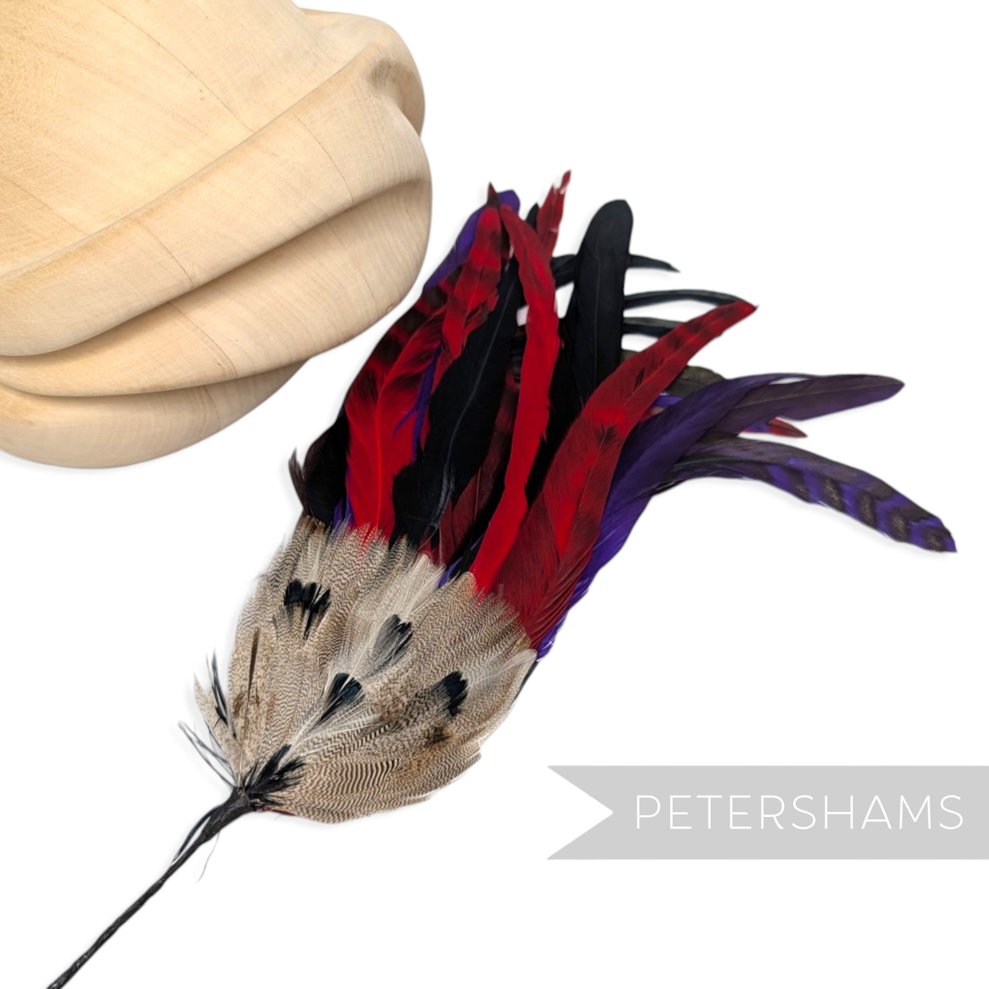 Petershams Millinery Supplies large feather hat mount with red, purple, and pheasant feathers on a wire stem.