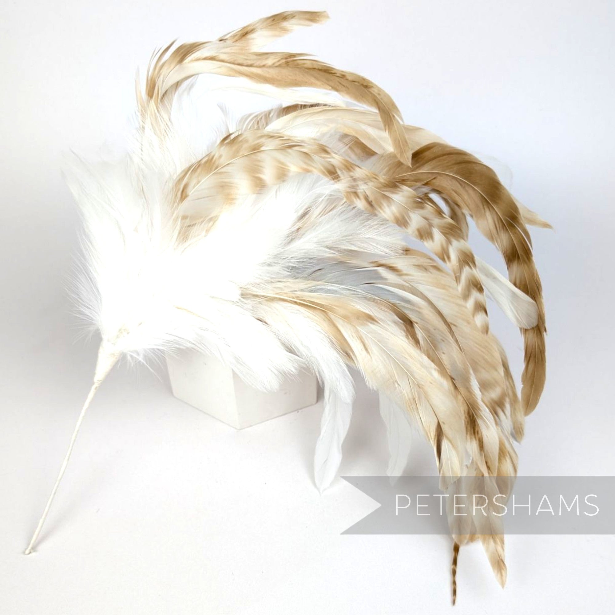 Petershams Millinery Supplies extra large feather hat mount with white hackle and chinchilla pattern coque feathers.