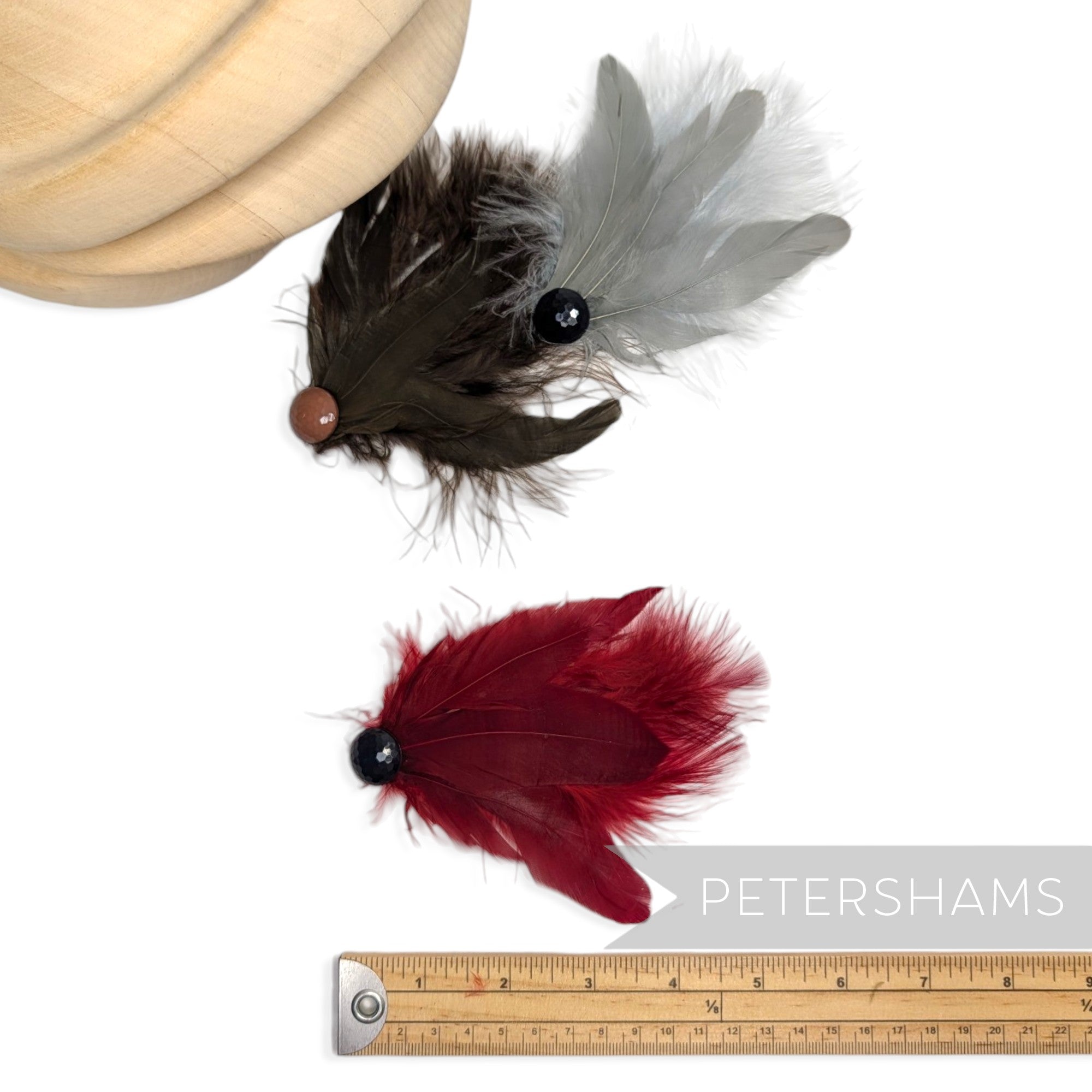 Petershams Millinery Supplies marabou and coque feather hat mounts with faceted bead accents in red, brown, and grey.