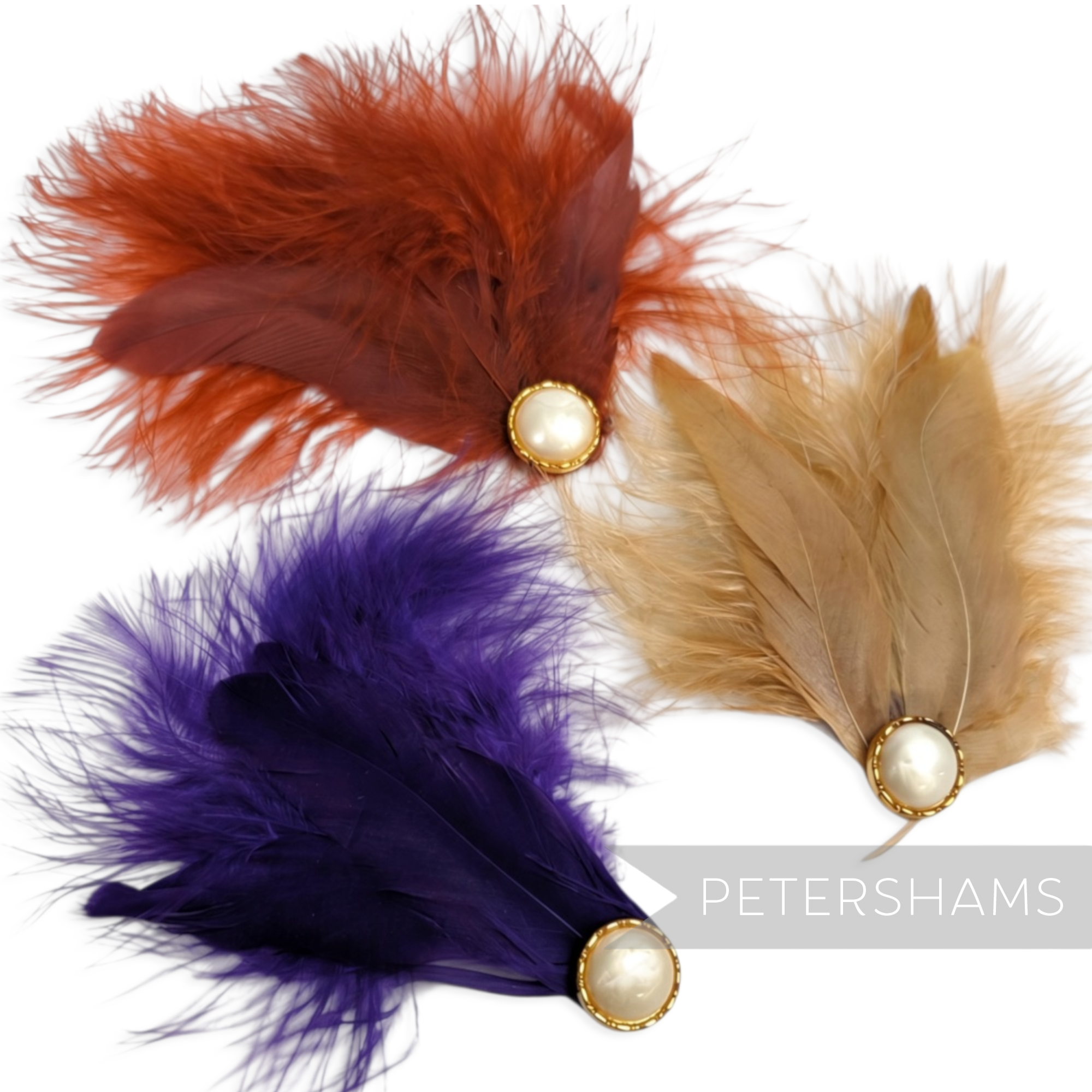 Petershams Millinery Supplies marabou and coque feather hat mounts in orange, purple, and tan with pearl cabochons.