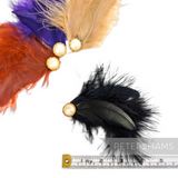 Petershams Millinery Supplies feather hat mounts in black, purple, and orange with pearlescent cabochon accents.