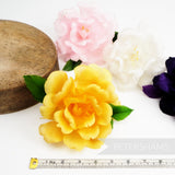 Petershams Millinery Supplies Angela goose feather rose flower hat mounts in yellow, pink, white, and purple.