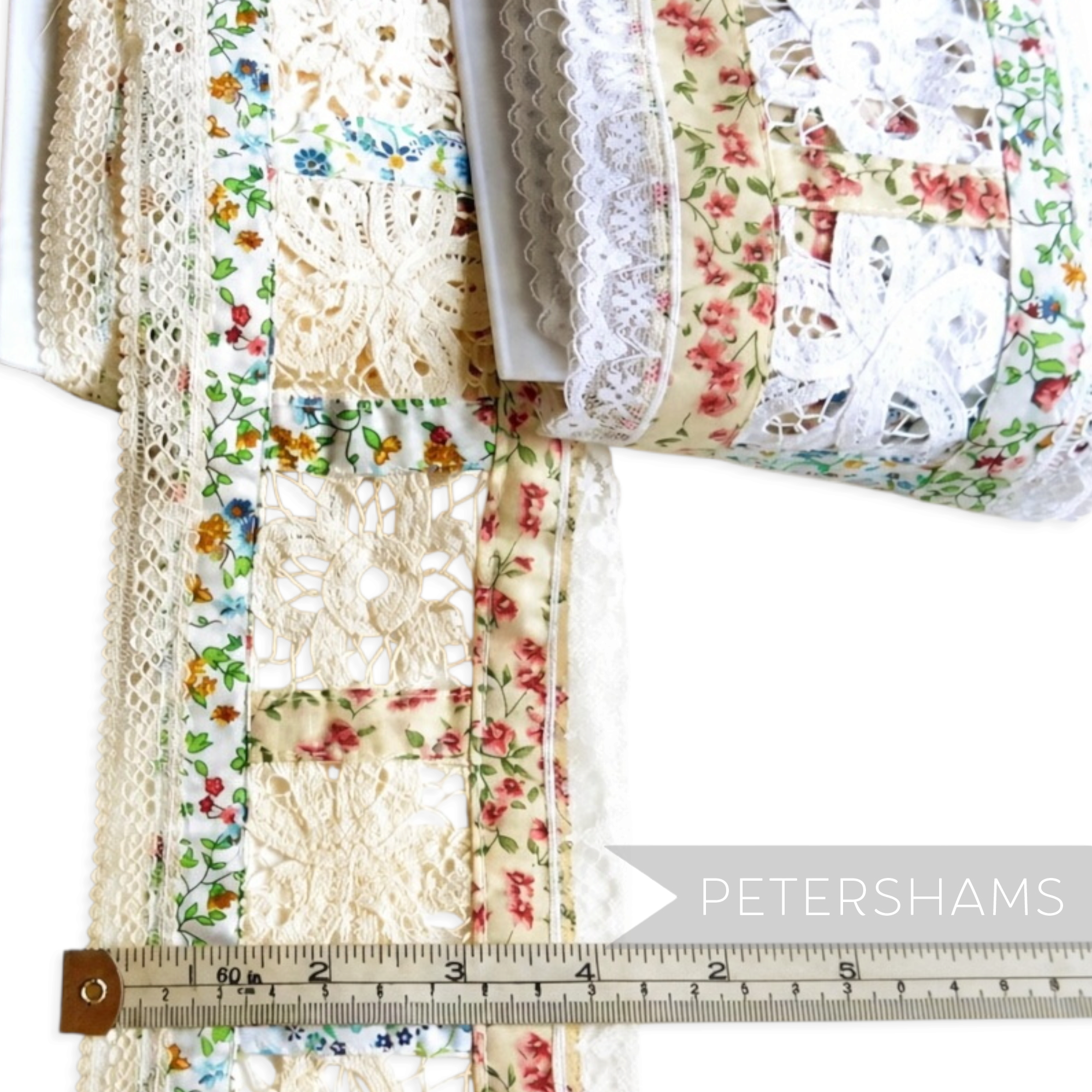 Petershams Millinery Supplies floral cotton patchwork trim with white lace edges and intricate lace flower inserts.