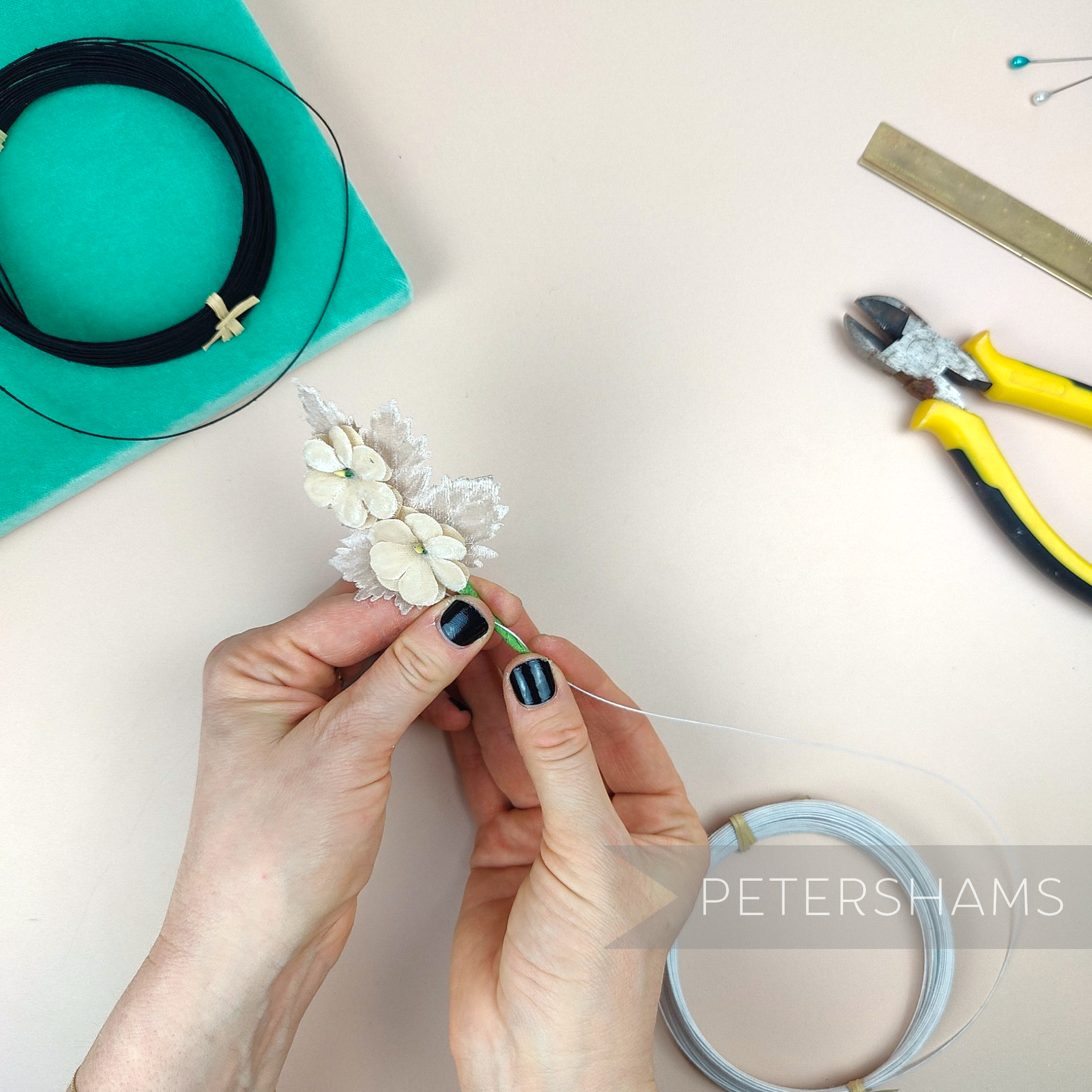 Petershams Millinery Supplies 0.4mm French cotton covered millinery wire being used to craft delicate fabric flowers.
