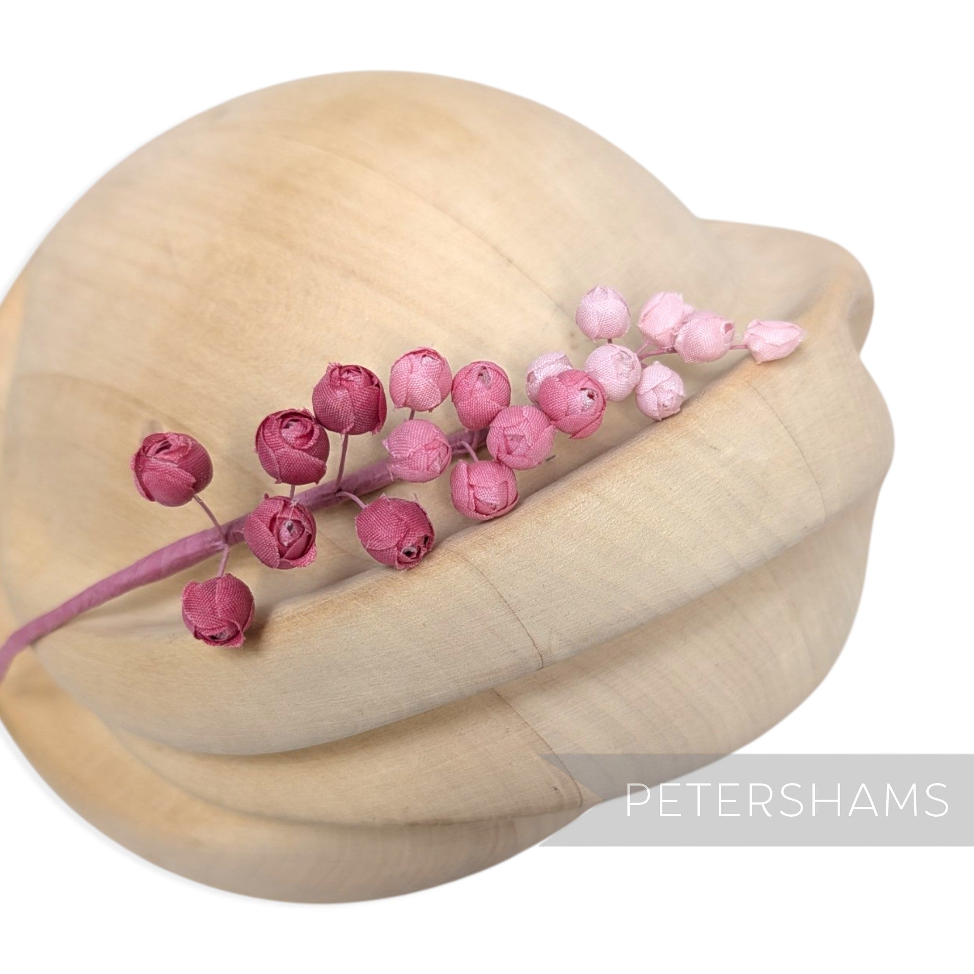 Petershams Millinery Supplies Giselle mini silk rosebud hat mount in graduated pink shades on a flexible wire stem.