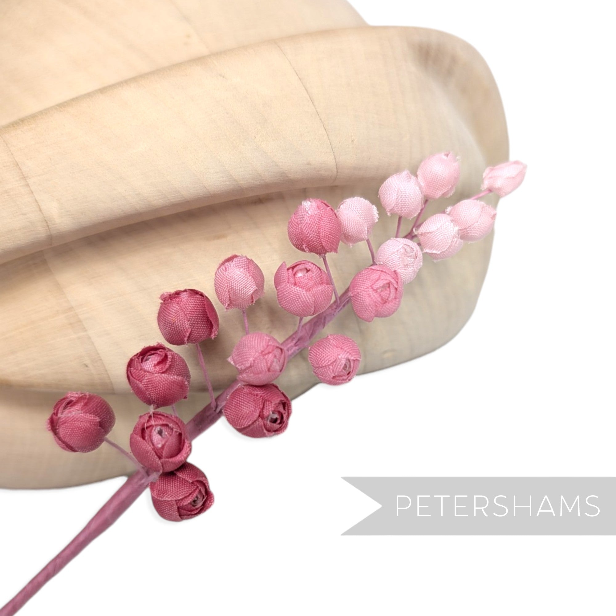 Petershams Millinery Supplies Giselle silk rosebud hat mount in shades of pink on a flexible wired stem.