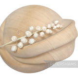 Petershams Millinery Supplies Giselle mini silk wired rosebud hat mount on a wooden millinery block